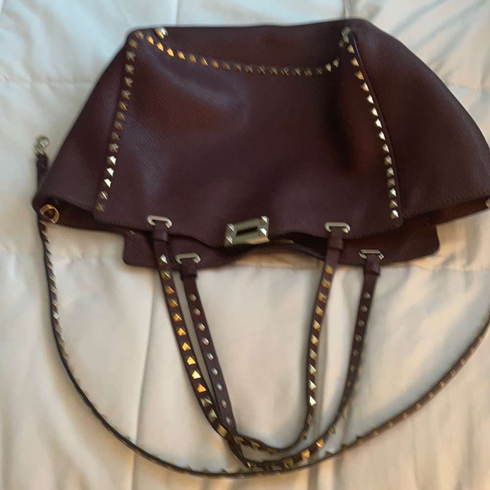 A burgundy beautiful purse in great condition.